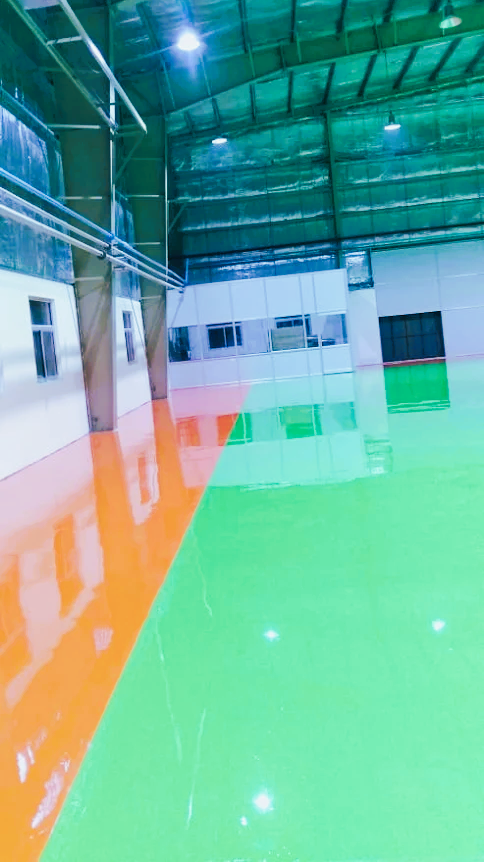Commercial epoxy flake floor with blue flakes in warehouse