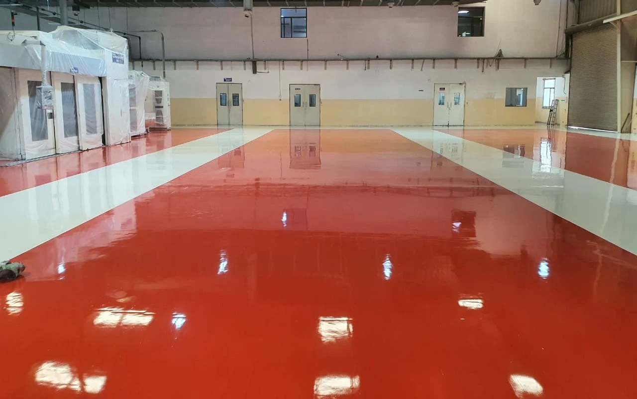 workers grinding floor surface